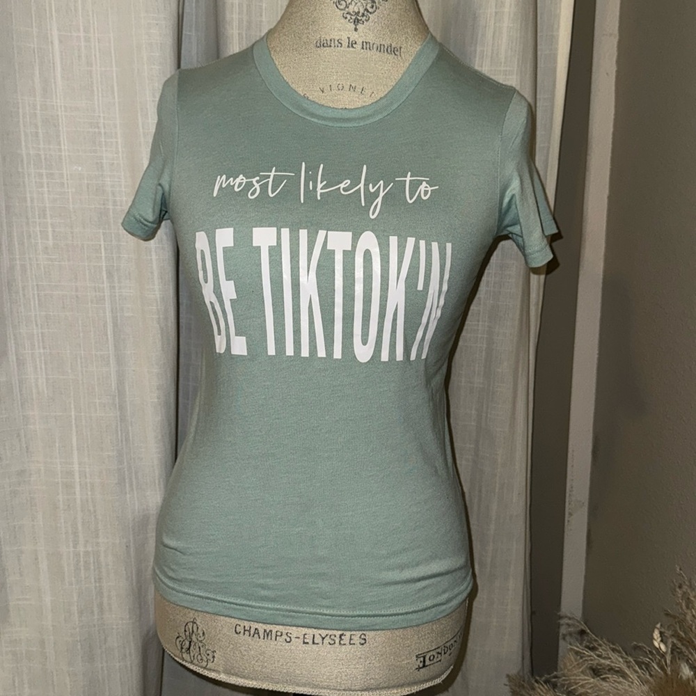 Bella Canvas Kids sage green shortsleeve t-shirt Most Likely to TikTok’n M 10-12